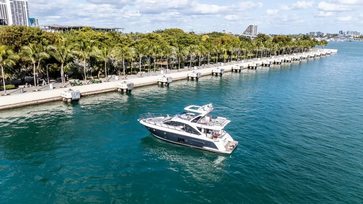 52' Azimut Yacht Charter aerial view cruising beside Museum Park in Miami.