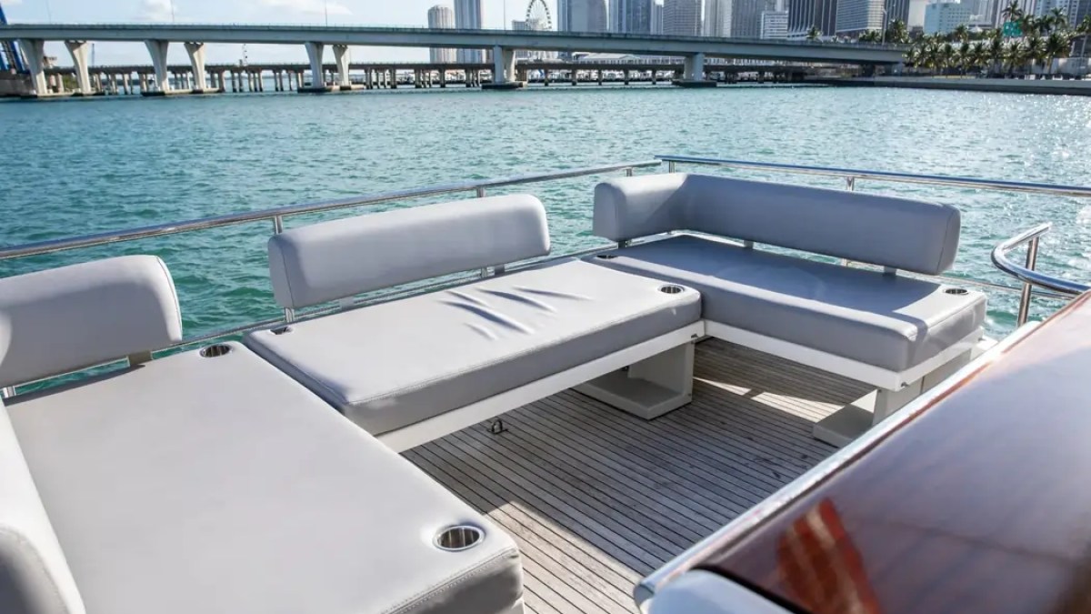 52' Azimut Yacht Charter aft cockpit lounge with panoramic Miami skyline views.