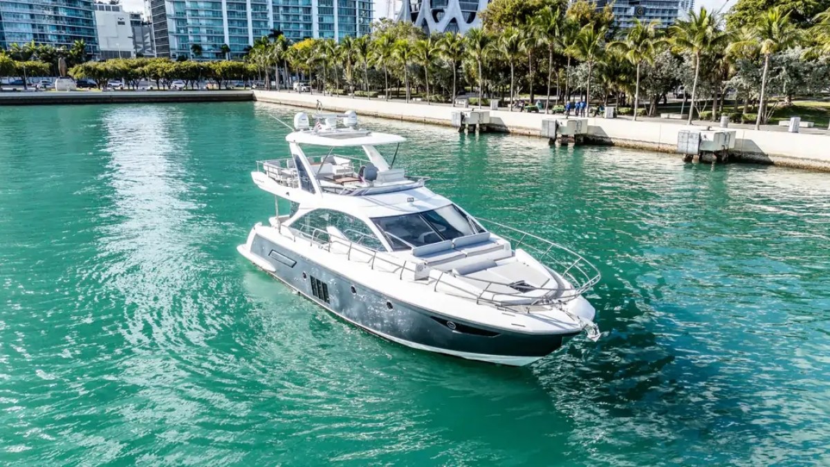 52' Azimut Yacht Charter cruising Biscayne Bay with the Miami skyline in the background.