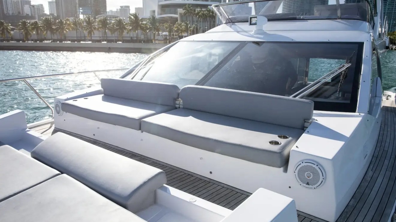Bow lounge aboard a 52' Azimut Yacht Charter featuring spacious sun pads and premium seating in Miami.