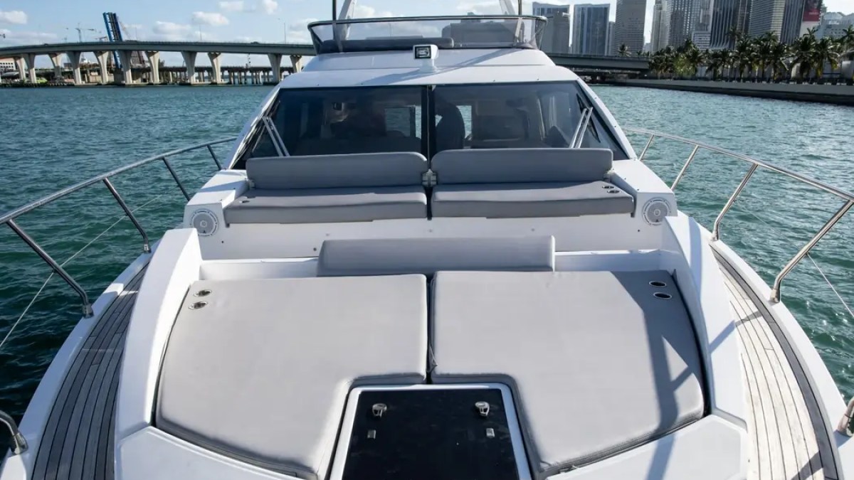 52' Azimut Yacht Charter spacious bow sun pad with premium lounge seating in Miami.