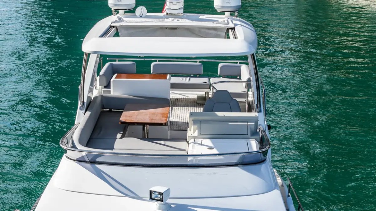 52' Azimut Yacht Charter flybridge helm and lounge with panoramic Miami water views.