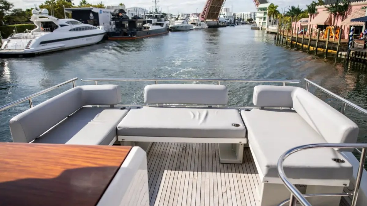 52' Azimut Yacht Charter expansive flybridge lounge with Miami River views.