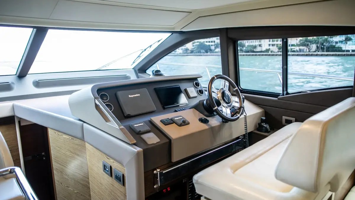 52' Azimut Yacht Charter lower helm station with Raymarine navigation system in Miami.