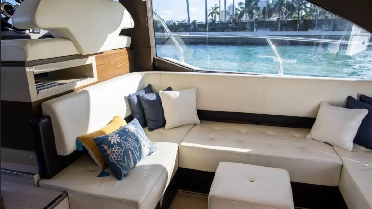 52' Azimut Yacht Charter luxury salon lounge with panoramic side windows in Miami.