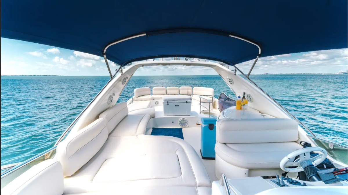 65' Azimut Yacht Charter flybridge helm and lounge with panoramic Miami views.
