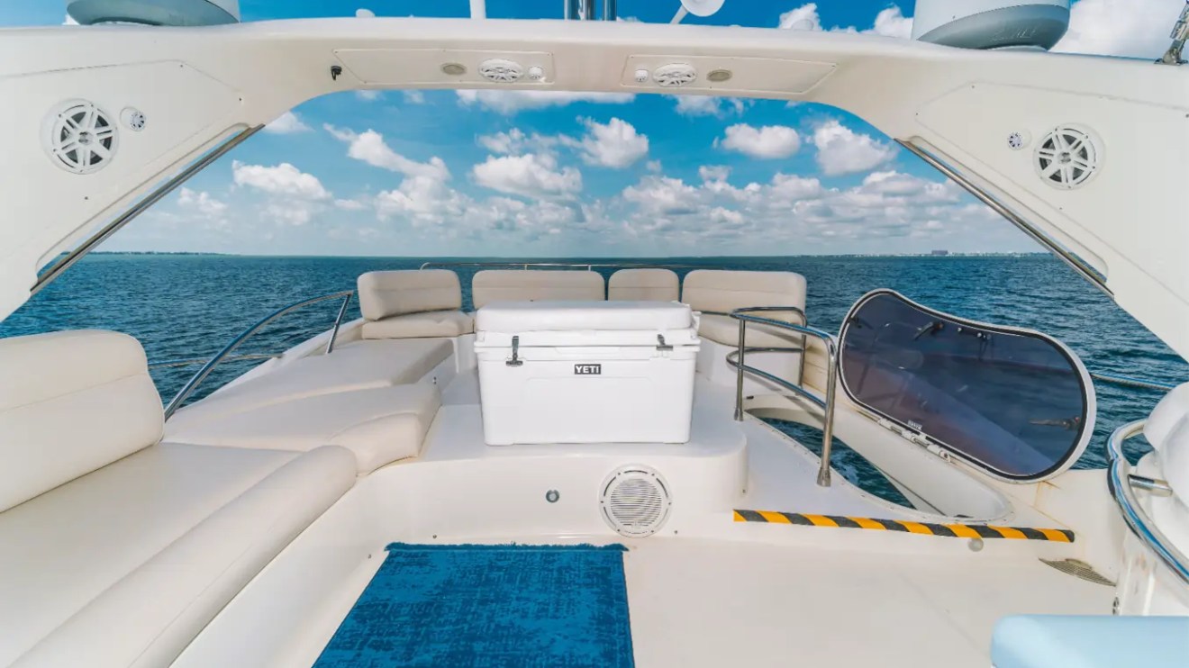 65' Azimut Yacht Charter flybridge lounge with premium seating overlooking Biscayne Bay in Miami.