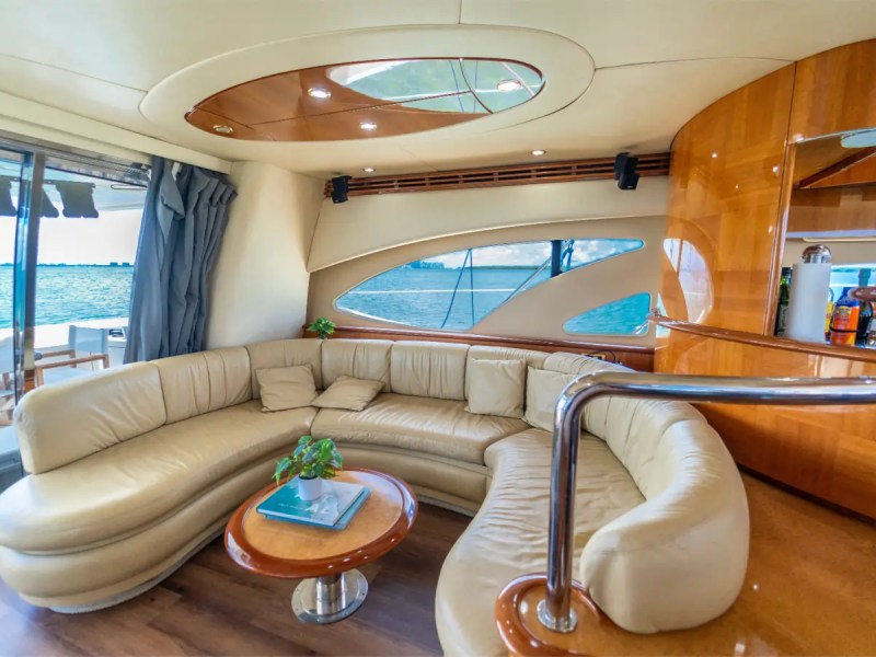 65' Azimut Yacht Charter luxury salon lounge with panoramic windows in Miami.