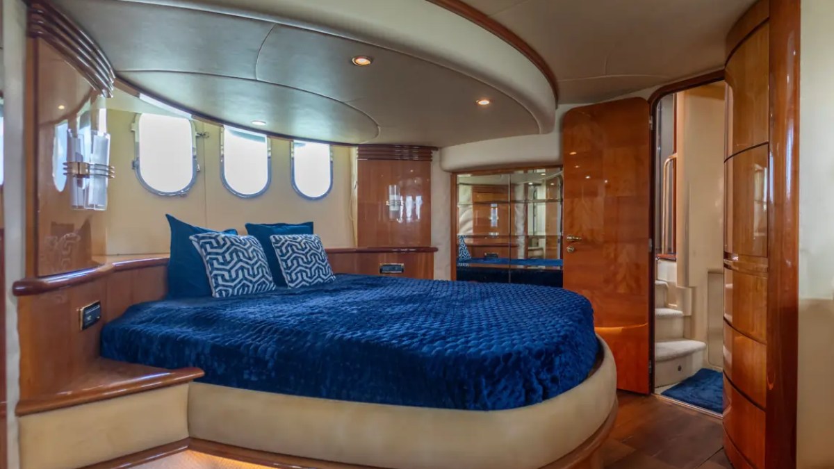 65' Azimut Yacht Charter master stateroom with king bed and luxury ensuite accommodations in Miami.