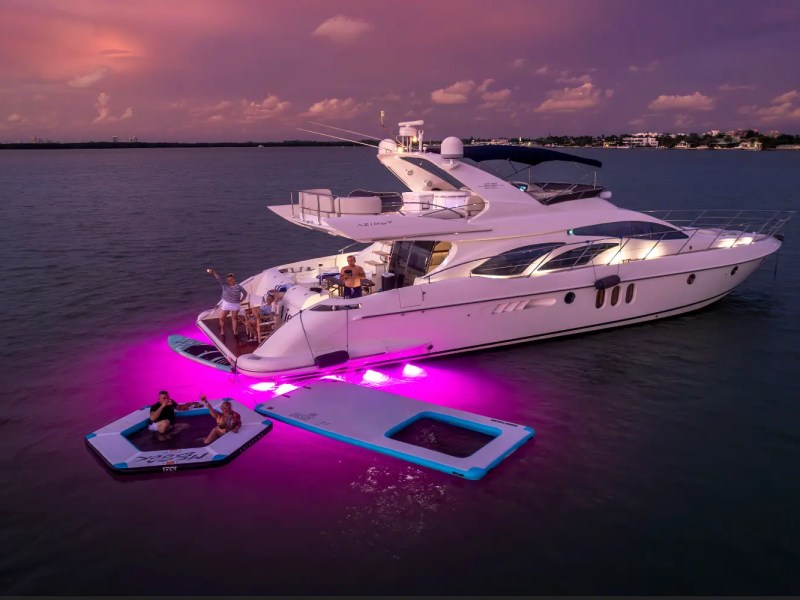 65' Azimut Yacht Charter at sunset in Miami with underwater lights, Magic Carpet & luxury water toys.