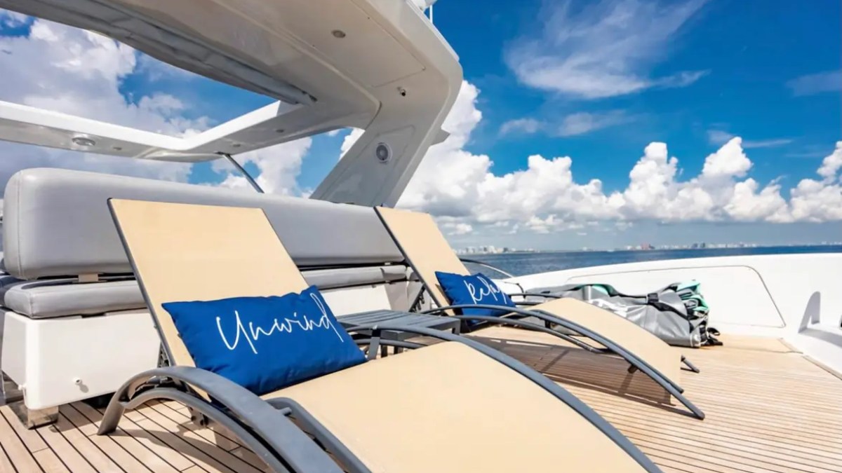 70' Azimut Yacht Charter luxury flybridge sun loungers overlooking Biscayne Bay during a private Miami yacht charter.