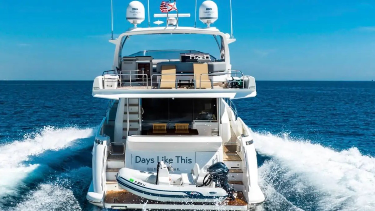 70' Azimut Yacht Charter cruising through the Atlantic with luxury flybridge and tender in Miami.