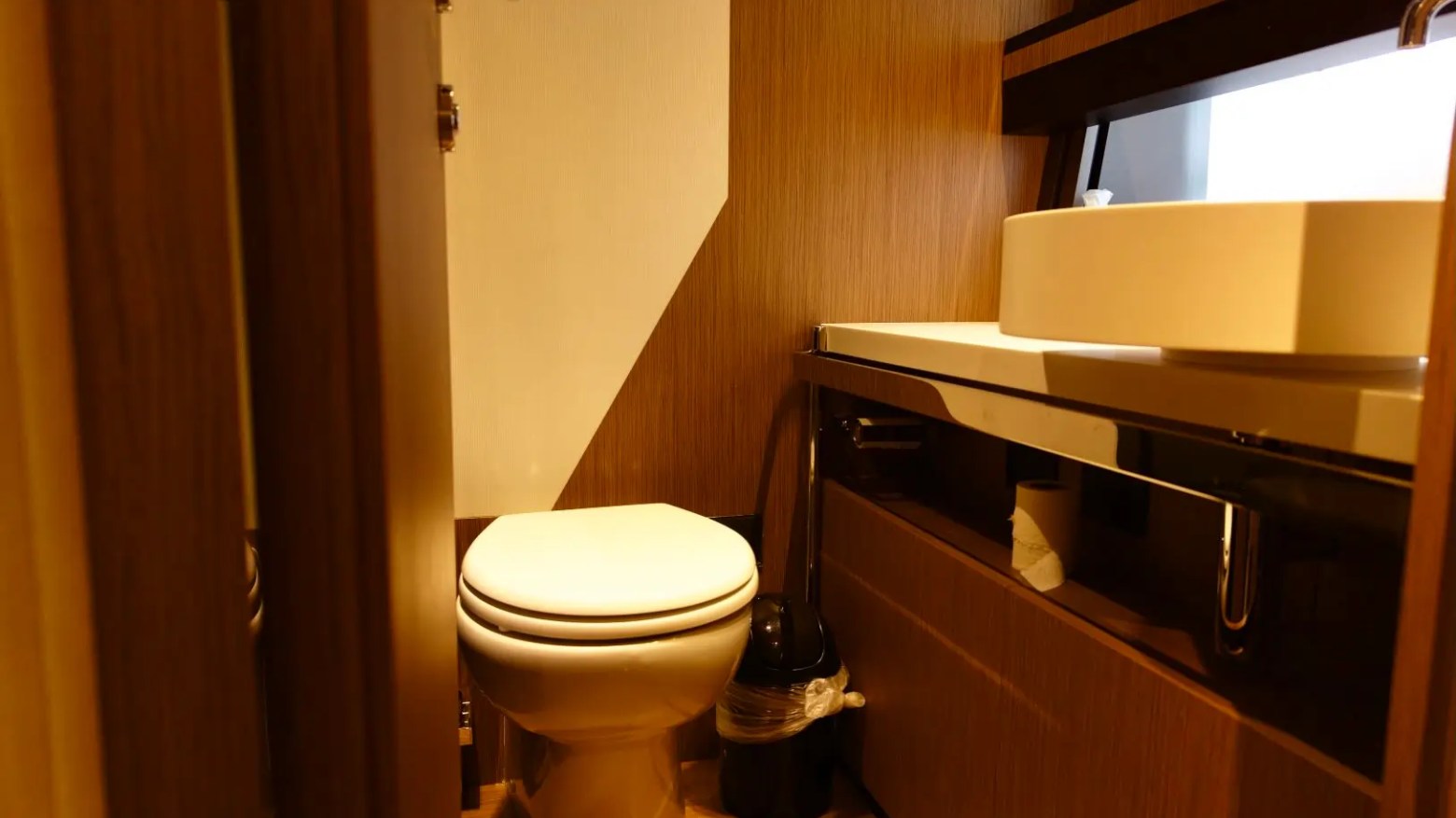 80' Ferretti Yacht Charter luxury day head bathroom aboard in Miami.