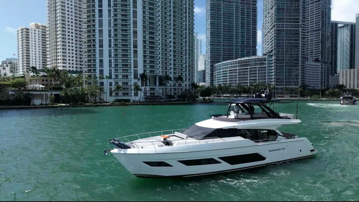 80' Ferretti Yacht Charter cruising through Downtown Miami on Biscayne Bay.