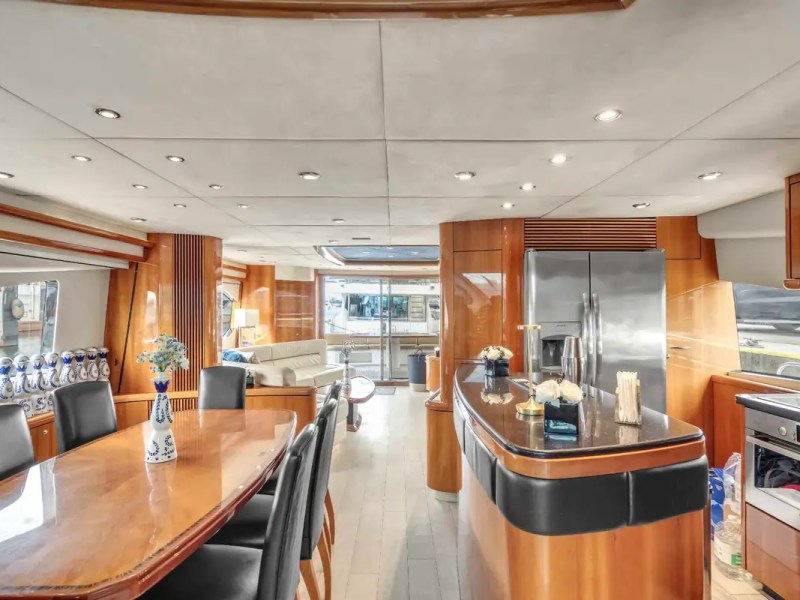 90' Azimut Yacht Charter gourmet galley and formal dining area with luxury interior in Miami.