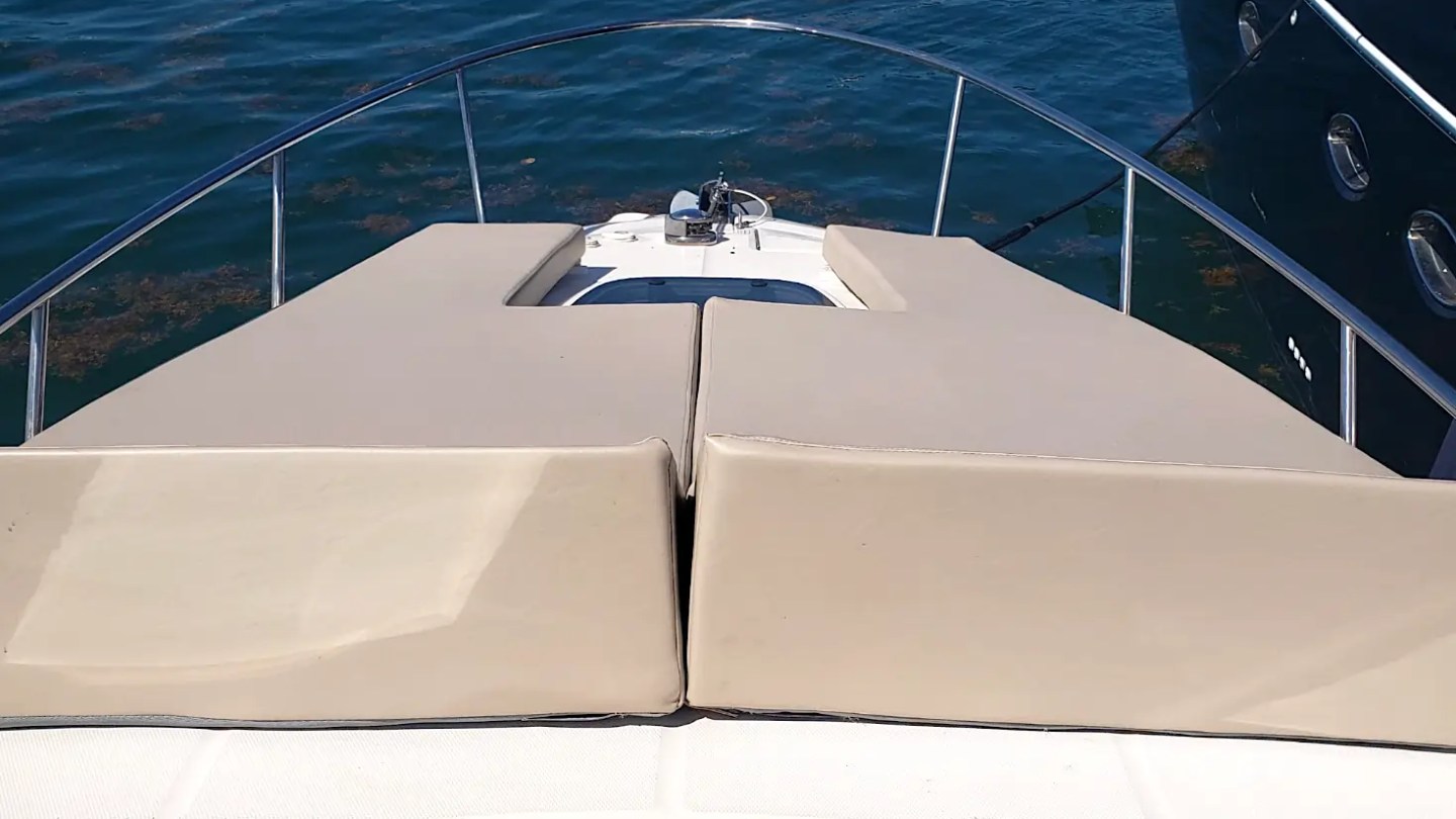 30' SeaRay Boat Rental oversized bow sun pad offering the perfect place to relax, sunbathe, and enjoy panoramic views while anchored in Miami Beach on Biscayne Bay.