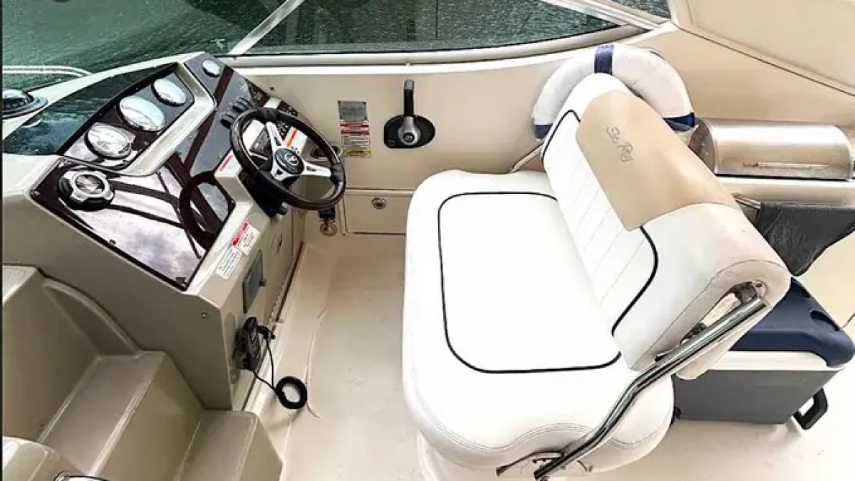 30' SeaRay Boat Rental flybridge helm station with captain controls, premium double helm seating, and elevated navigation views while cruising Miami Beach waterways.