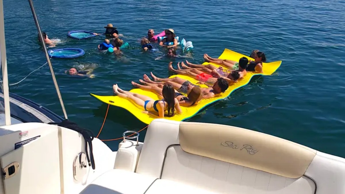 30' SeaRay Boat Rental at a Miami Beach sandbar with guests swimming, floating, and enjoying a fun-filled day on the crystal-clear waters of Biscayne Bay.