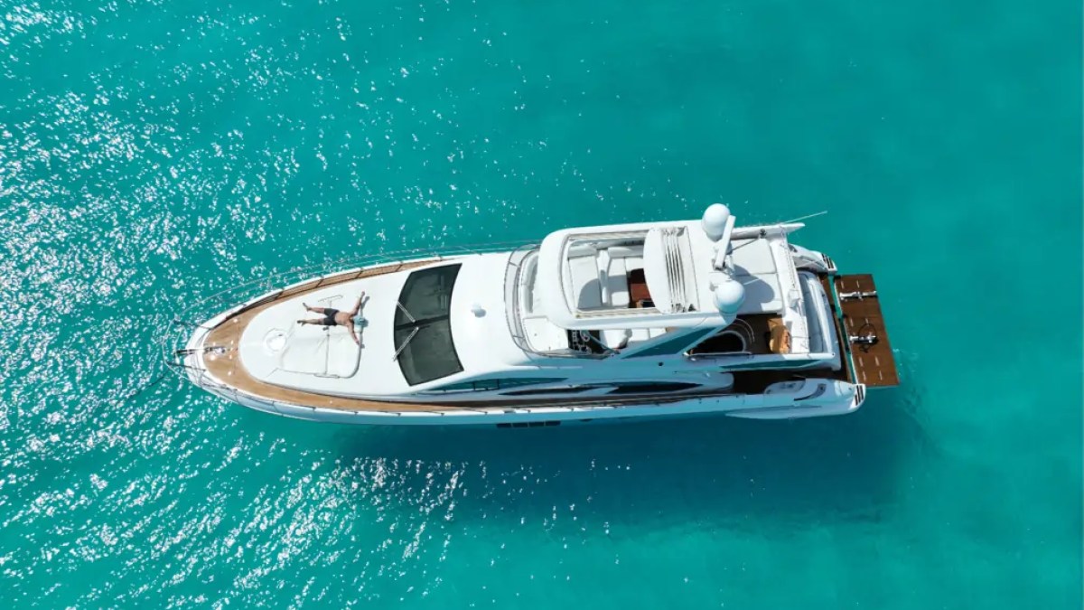 66' Azimut Yacht Charter aerial drone view anchored in turquoise Miami Beach waters.