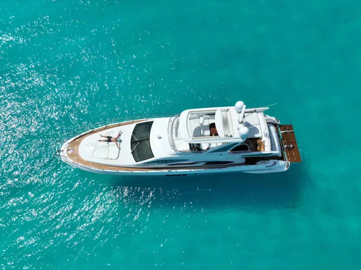 66' Azimut Yacht Charter aerial drone view anchored in turquoise Miami Beach waters.
