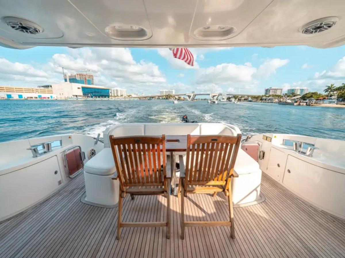 66' Azimut Yacht Charter aft deck dining with Intracoastal Waterway views in Miami Beach.