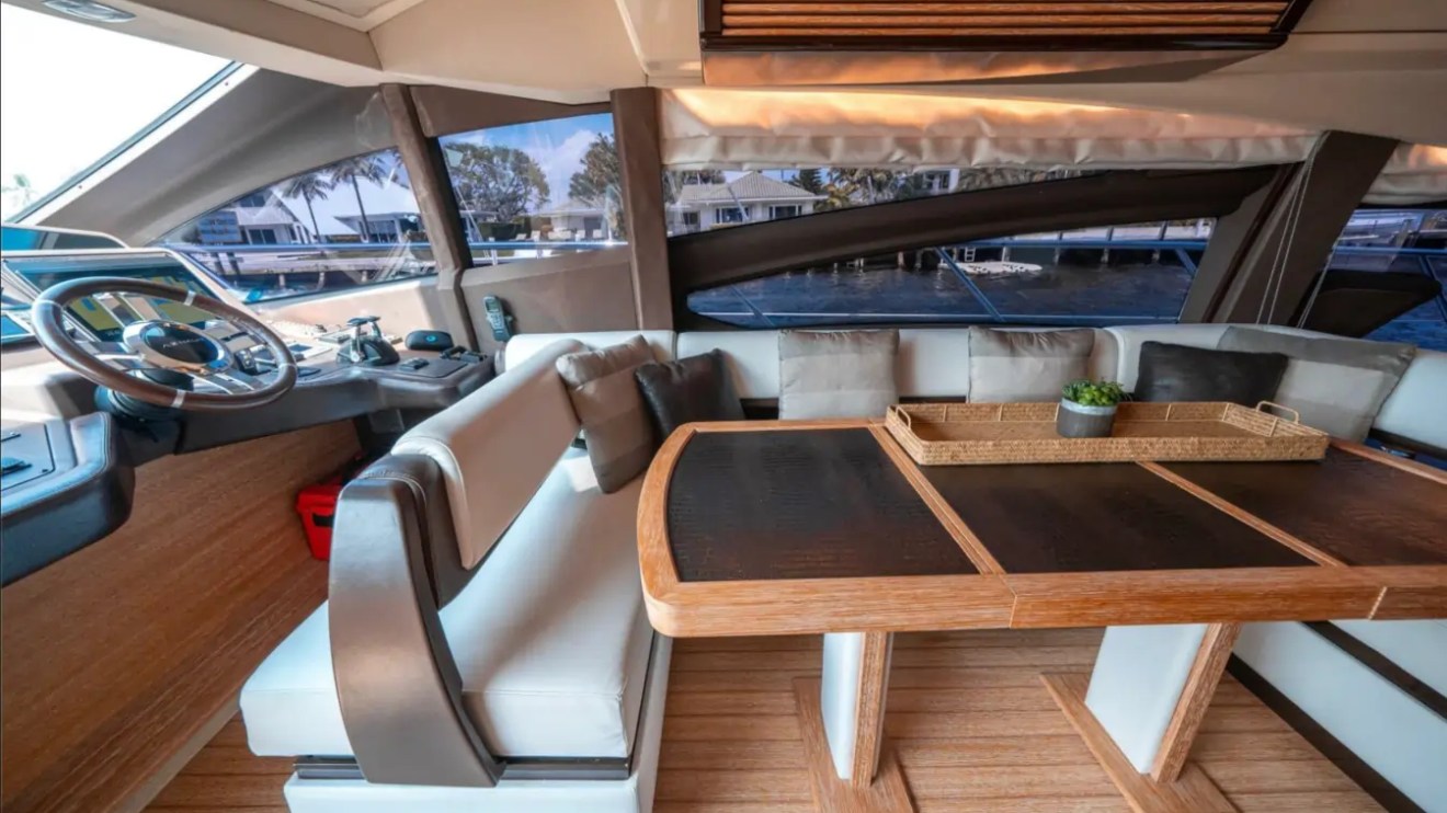 66' Azimut Yacht Charter formal dining lounge & lower helm in Miami Beach.