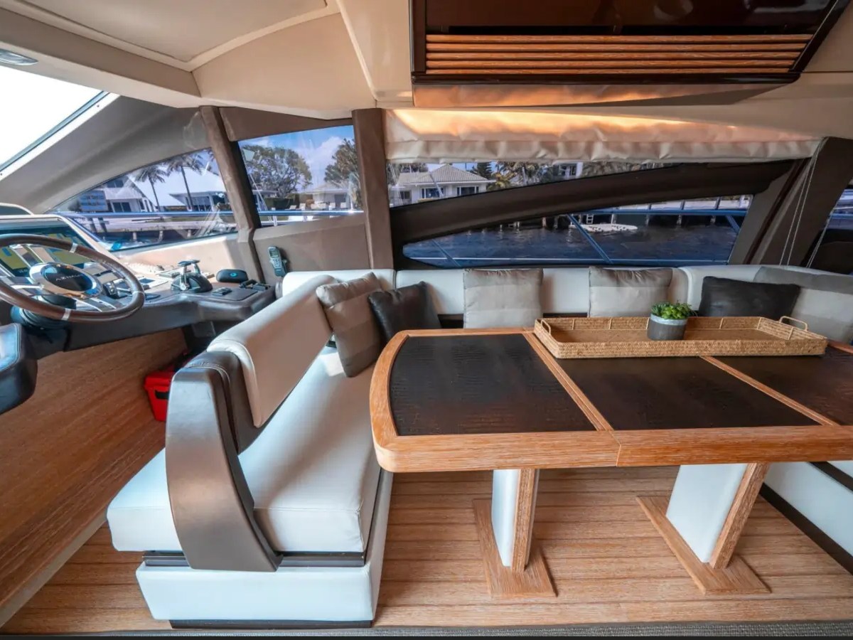 66' Azimut Yacht Charter formal dining lounge & lower helm in Miami Beach.