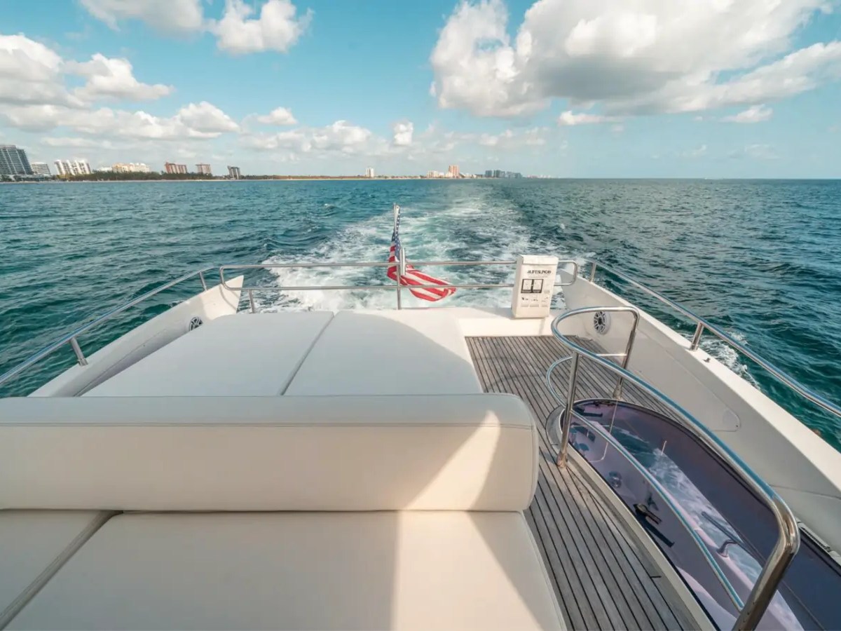 66' Azimut Yacht Charter flybridge sun pad with panoramic ocean views in Miami Beach.