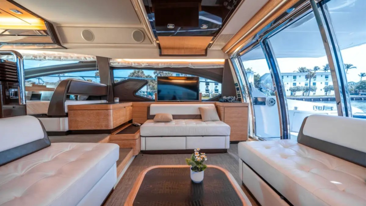 66' Azimut Yacht Charter luxury salon with panoramic windows in Miami Beach.
