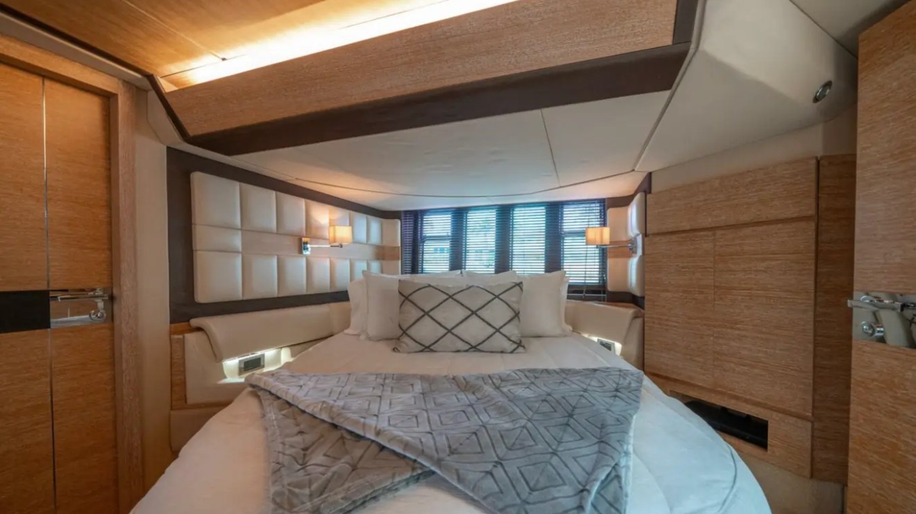 66' Azimut Yacht Charter luxury master stateroom with queen bed in Miami Beach.