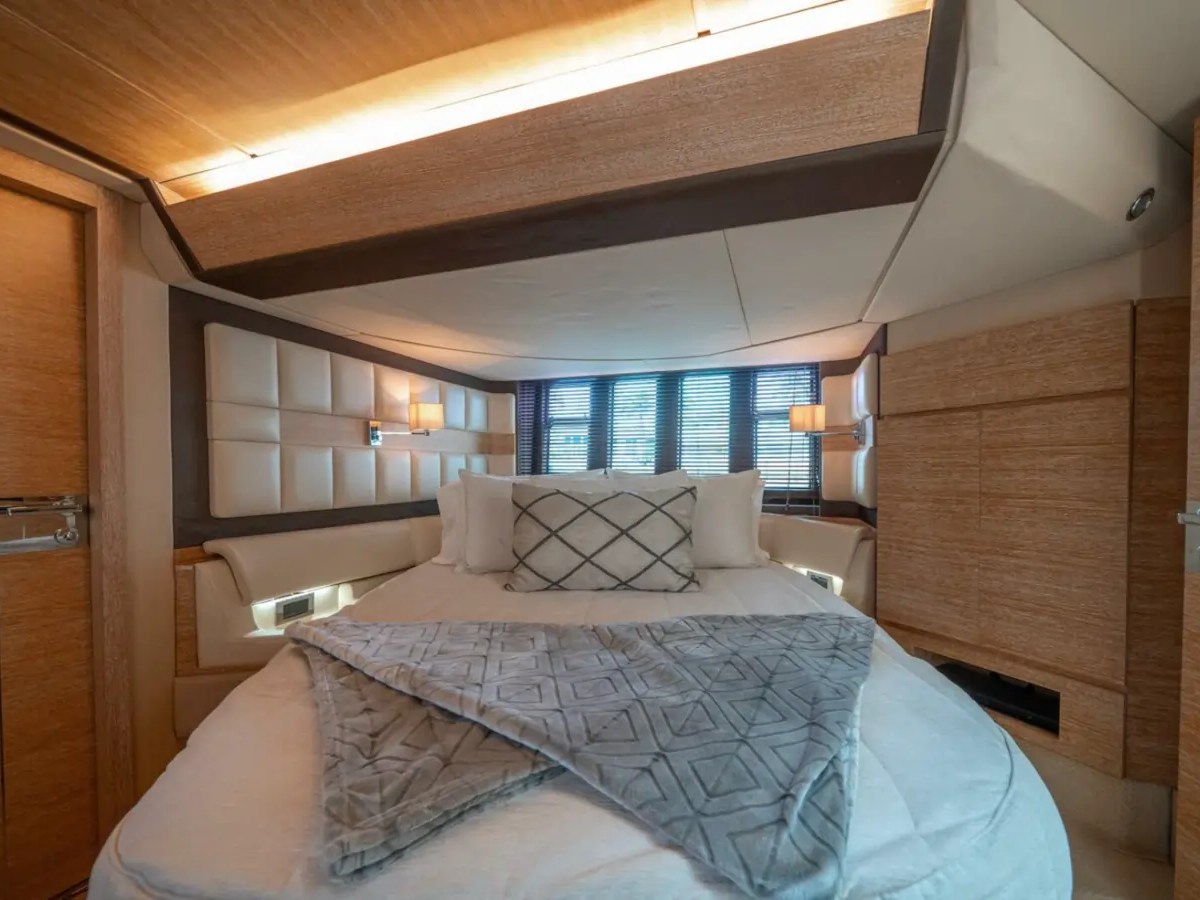 66' Azimut Yacht Charter luxury master stateroom with queen bed in Miami Beach.