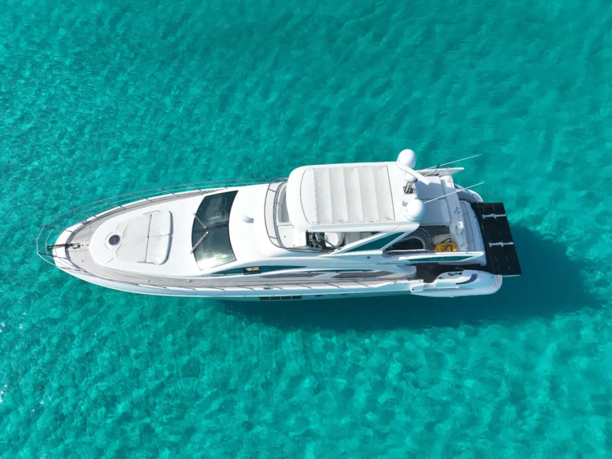 66' Azimut Yacht Charter top-down aerial drone view over crystal-clear waters in Miami Beach.