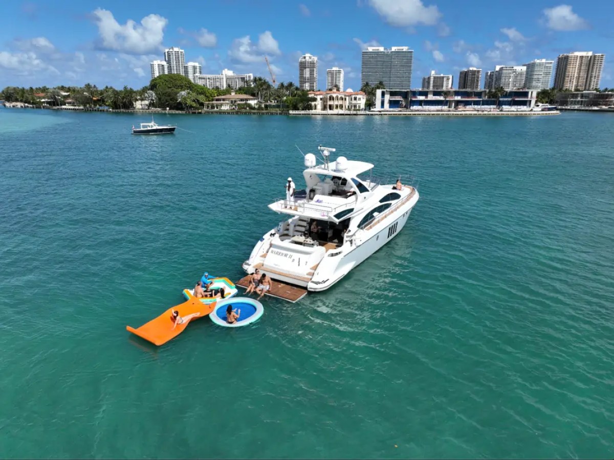 66' Azimut Yacht Charter anchored with water toys in Miami Beach.