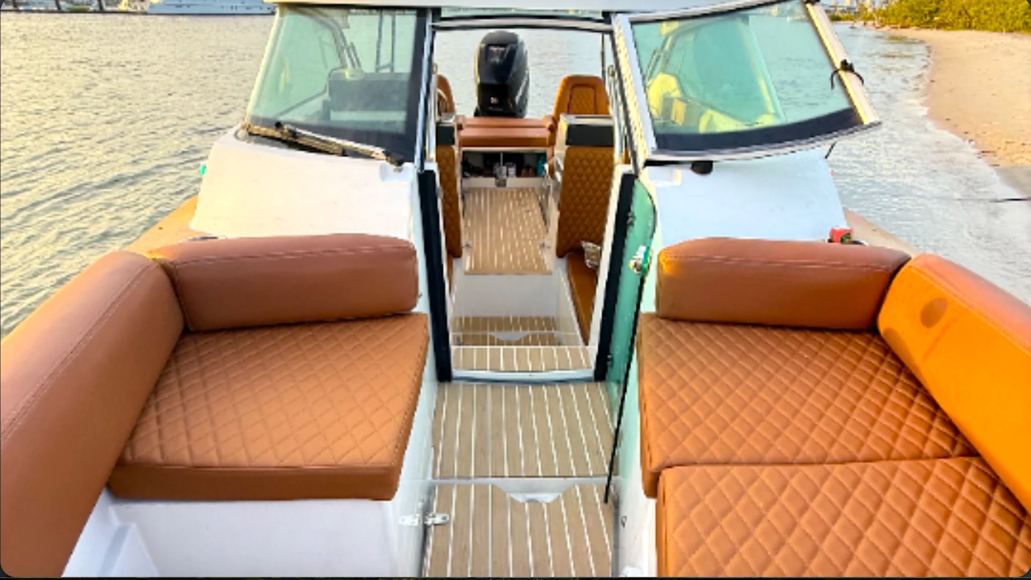 Spacious bow lounge seating aboard a 26' Axopar Boat Rental near Peanut Island in Riviera Beach, Florida.