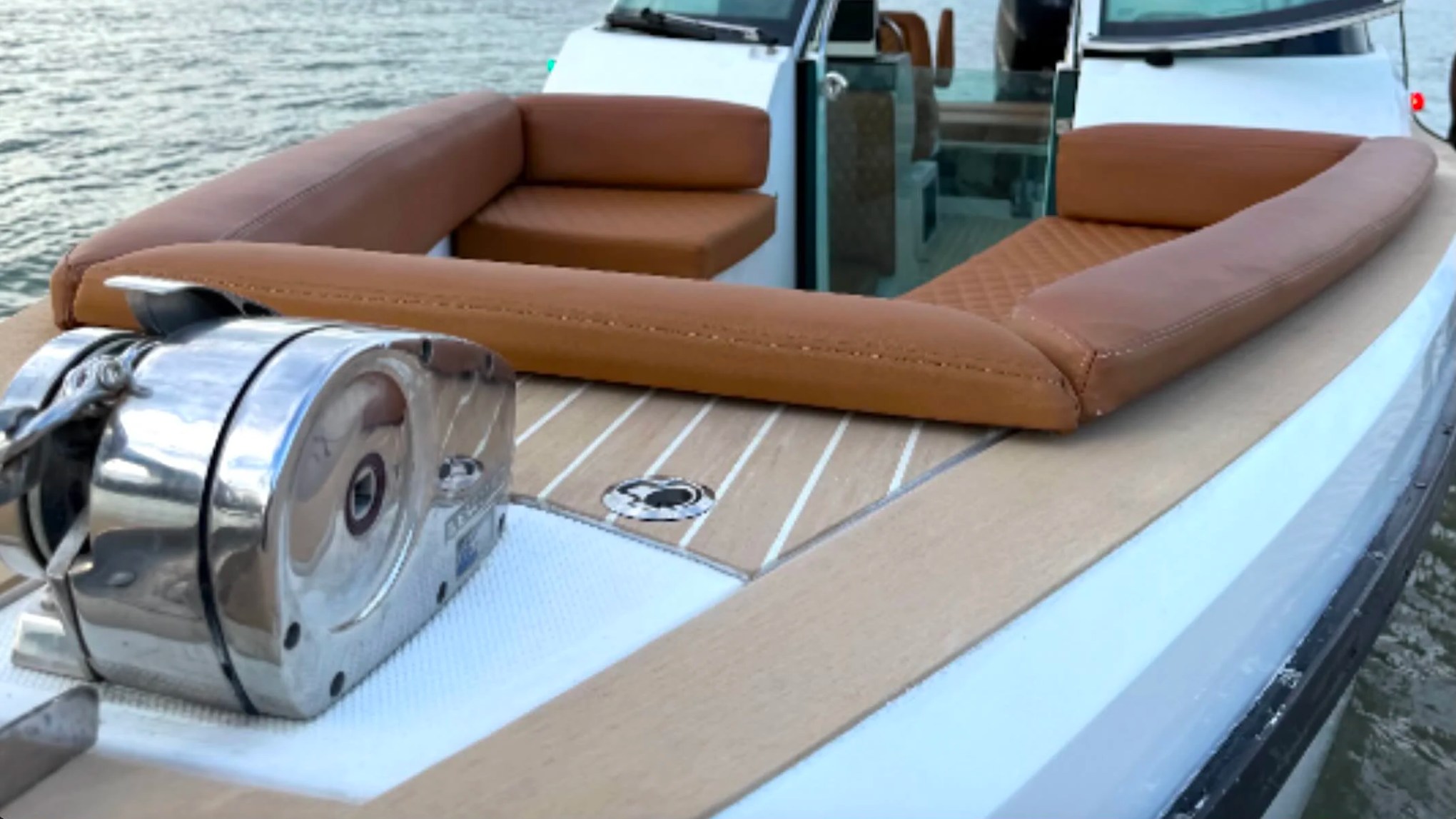 Premium bow lounge seating and anchor system aboard a 26' Axopar Boat Rental in Riviera Beach, Florida.
