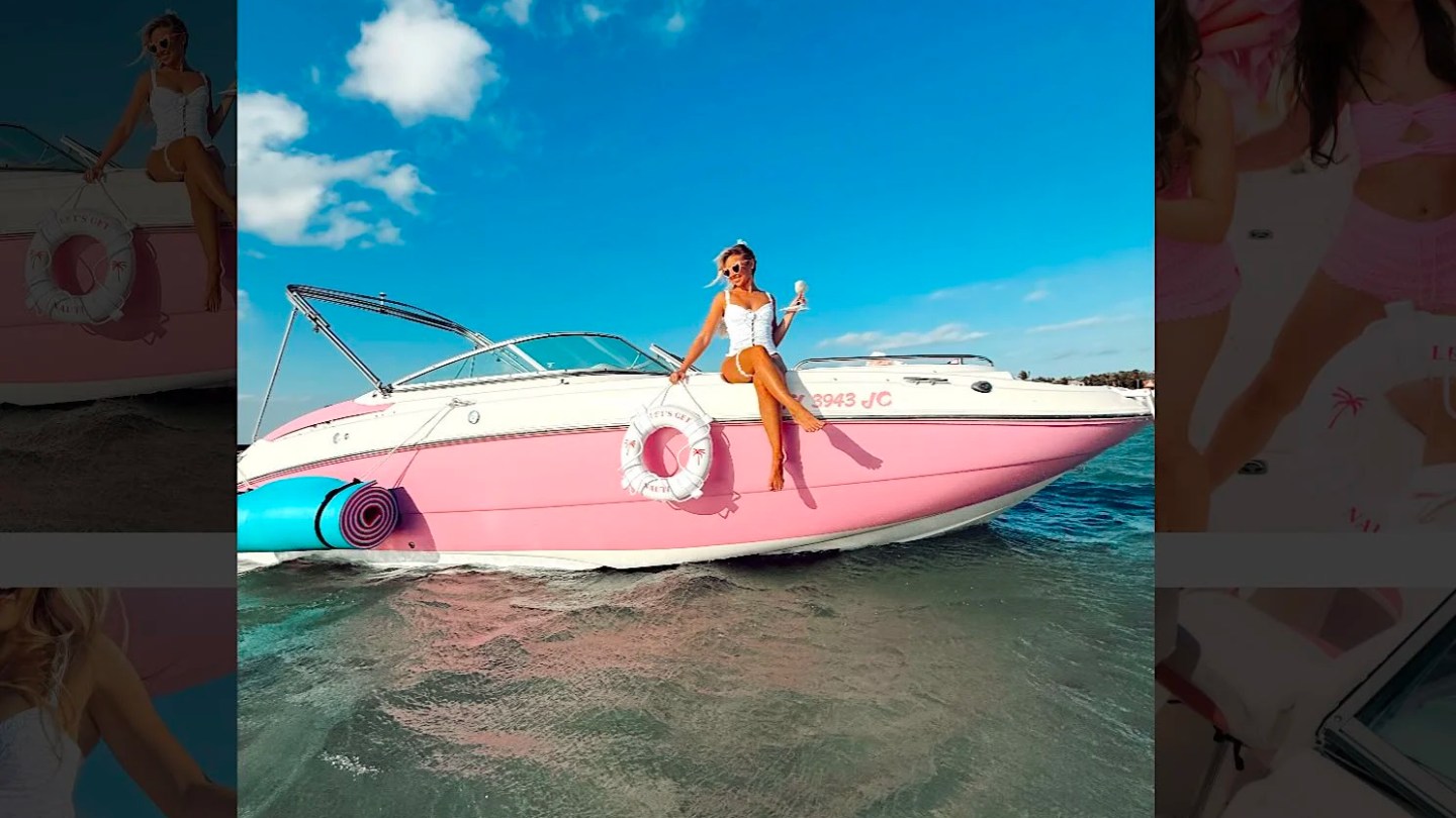 Woman relaxing on a pink 26' Hurricane Boat Rental during a tropical Riviera Beach boating adventure.