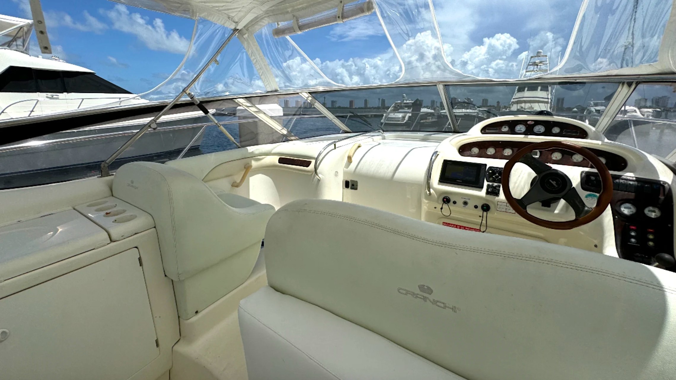 41' Cranchi Boat Rental helm station with captain controls and panoramic cockpit views in Riviera Beach.
