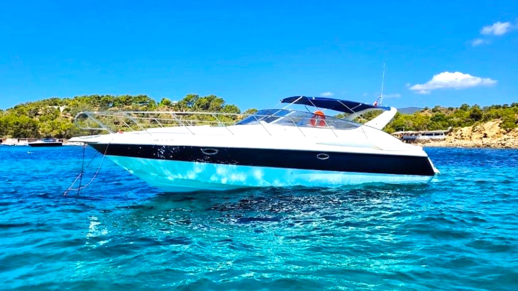 41' Cranchi Boat Rental anchored in crystal-clear turquoise water near Riviera Beach.