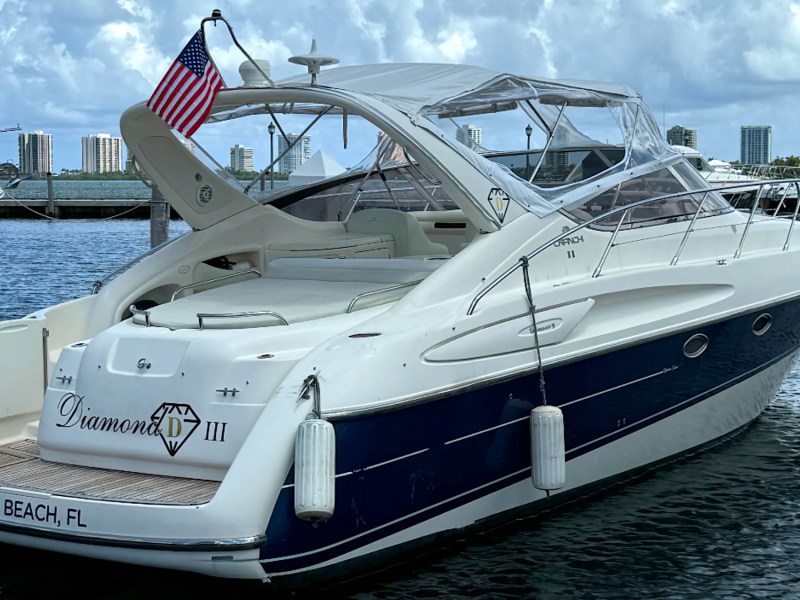 41' Cranchi Boat Rental docked at Riviera Beach Marina with Palm Beach skyline in the background.
