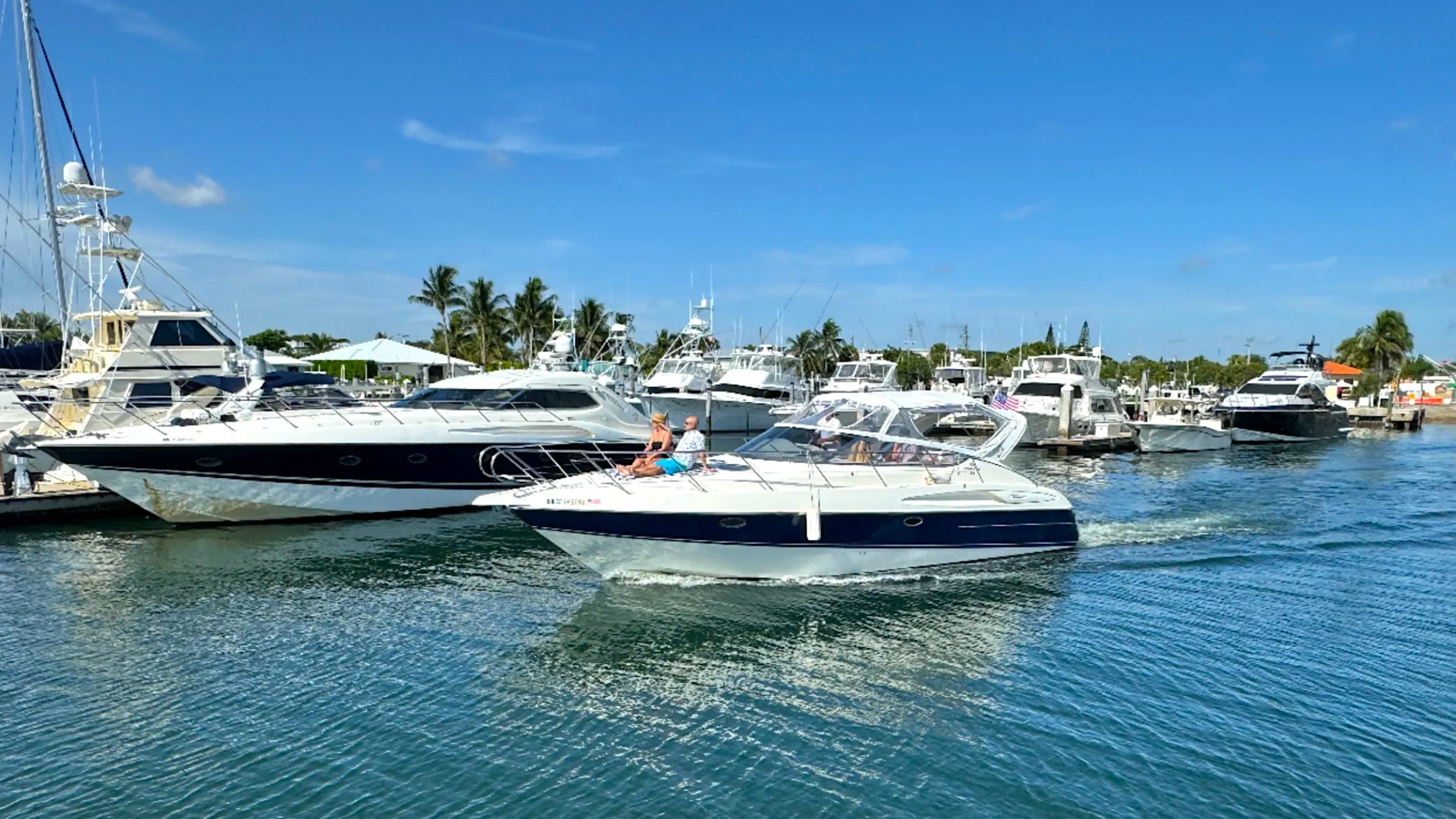 41' Cranchi Boat Rental cruising through Riviera Beach Marina with luxury express cruiser styling and Palm Beach yachts in the background.