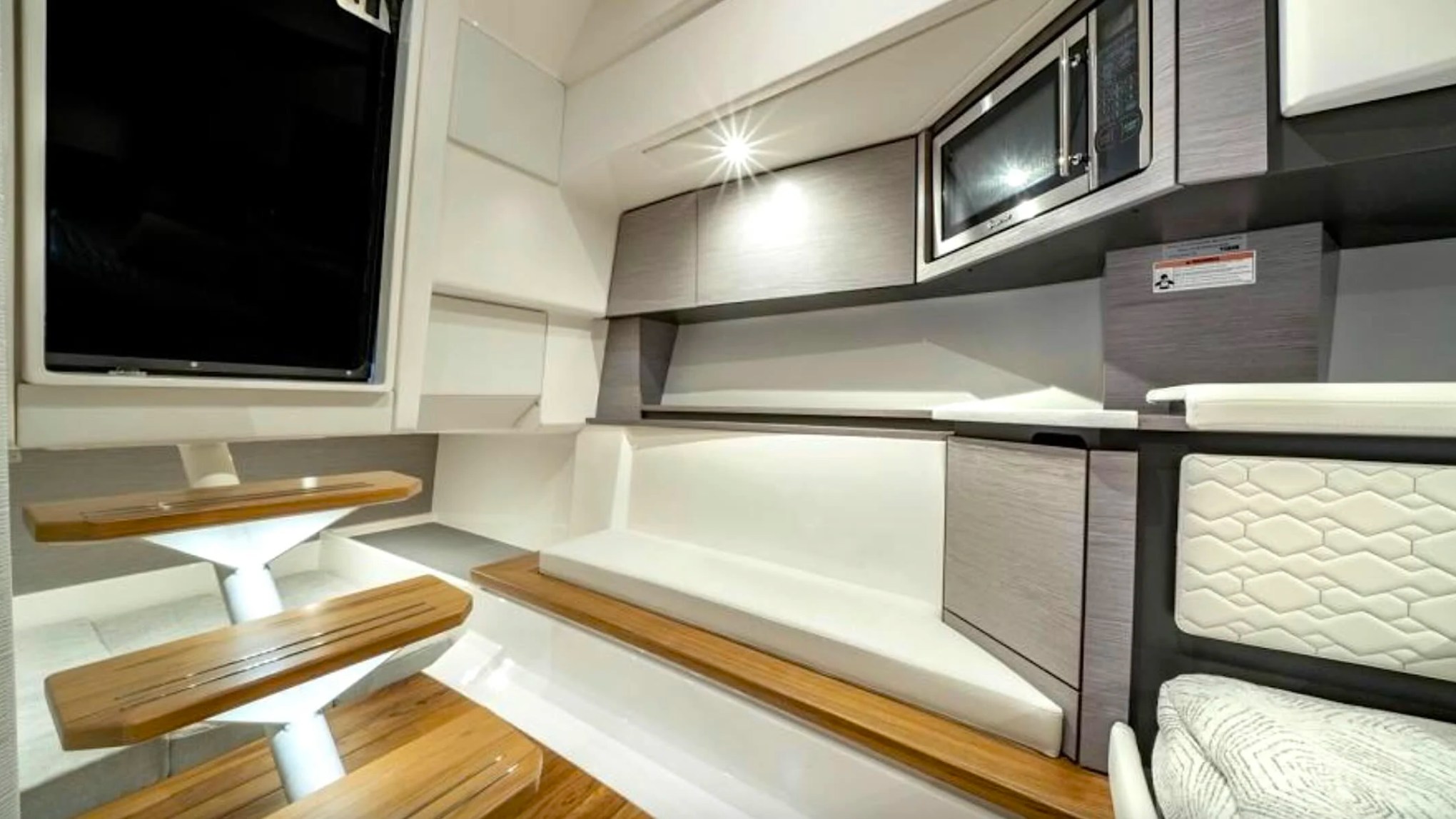 41' Tiara Boat Rental featuring modern cabin lounge and kitchenette in Riviera Beach.