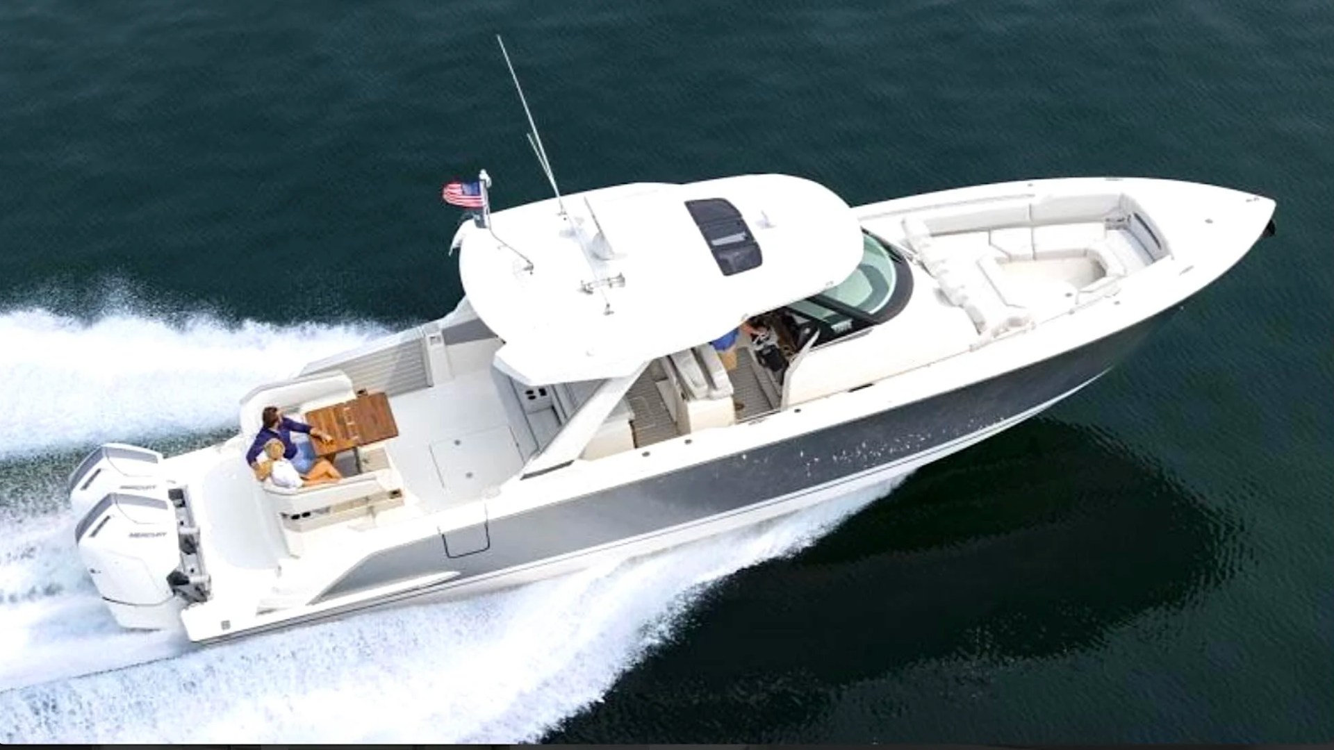 41' Tiara Boat Rental cruising offshore in Riviera Beach with twin Mercury outboards and spacious open-air deck.