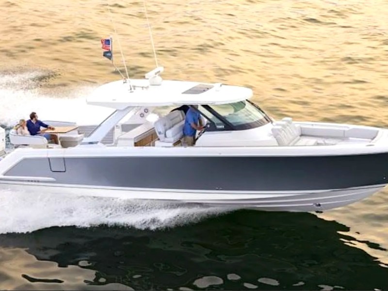 41' Tiara Boat Rental cruising at sunset in Riviera Beach with spacious luxury seating and twin Mercury outboards.