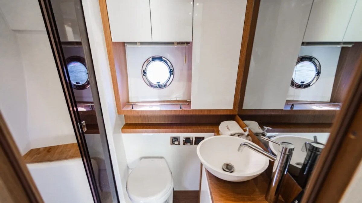 50' Beneteau Yacht Charter luxury bathroom with modern vanity and enclosed shower in Delray Beach Florida.