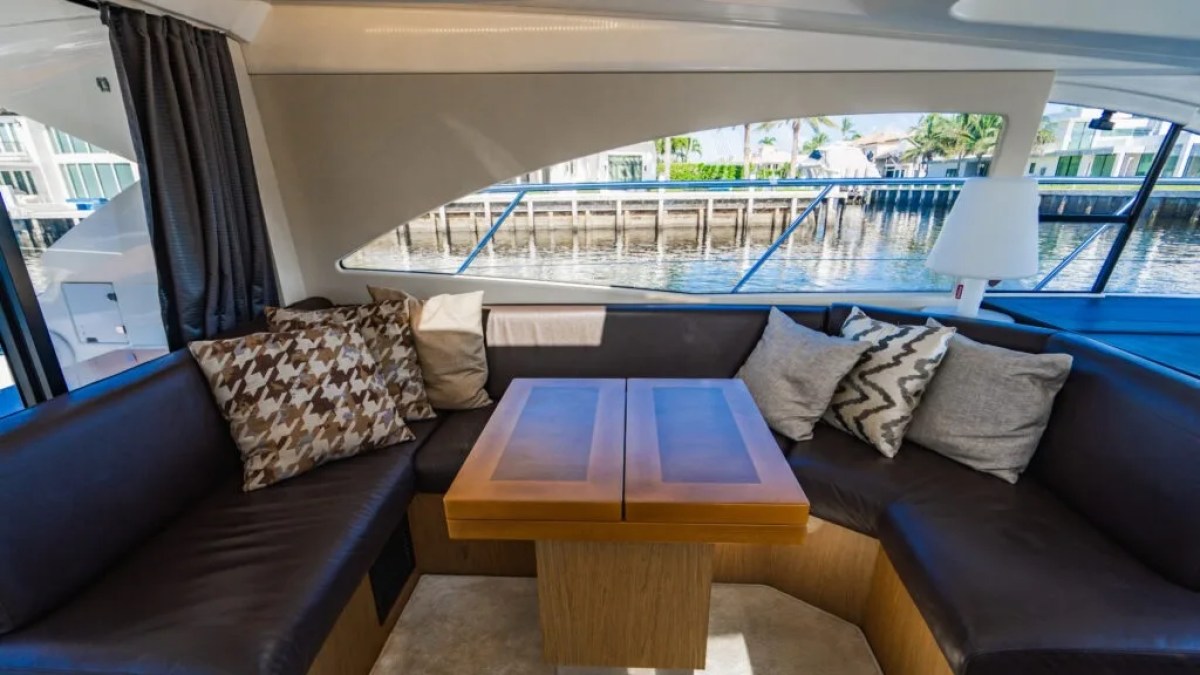 50' Beneteau Yacht Charter salon lounge with wraparound seating in Delray Beach Florida.