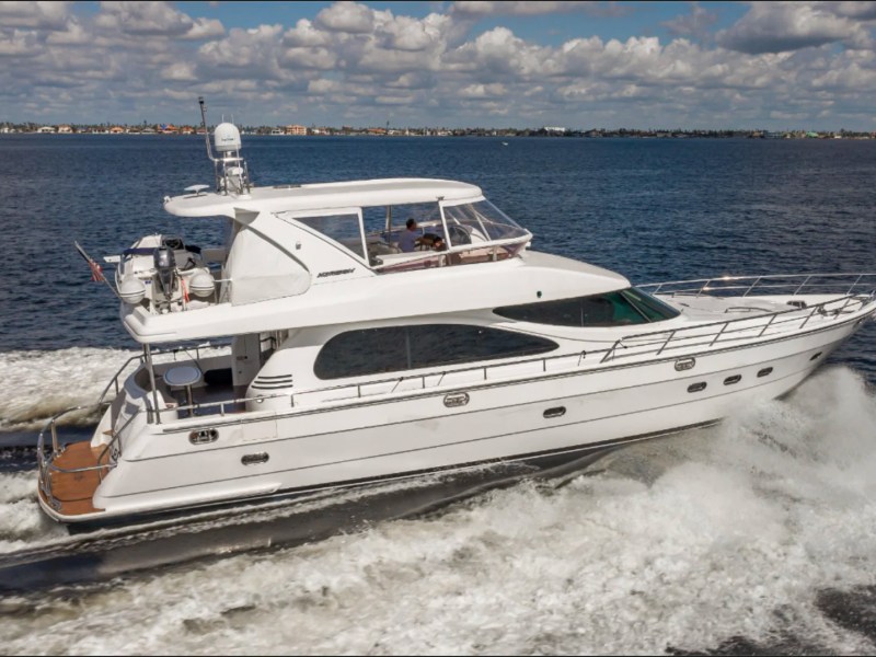 62' Horizon Yacht Charter cruising offshore in Fort Myers with spacious flybridge and luxury motor yacht profile.