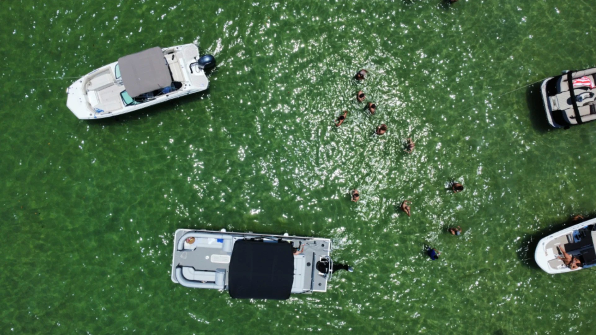 25' Bentley Boat Rental aerial view at a Hollywood Florida sandbar with swimmers and nearby boats.