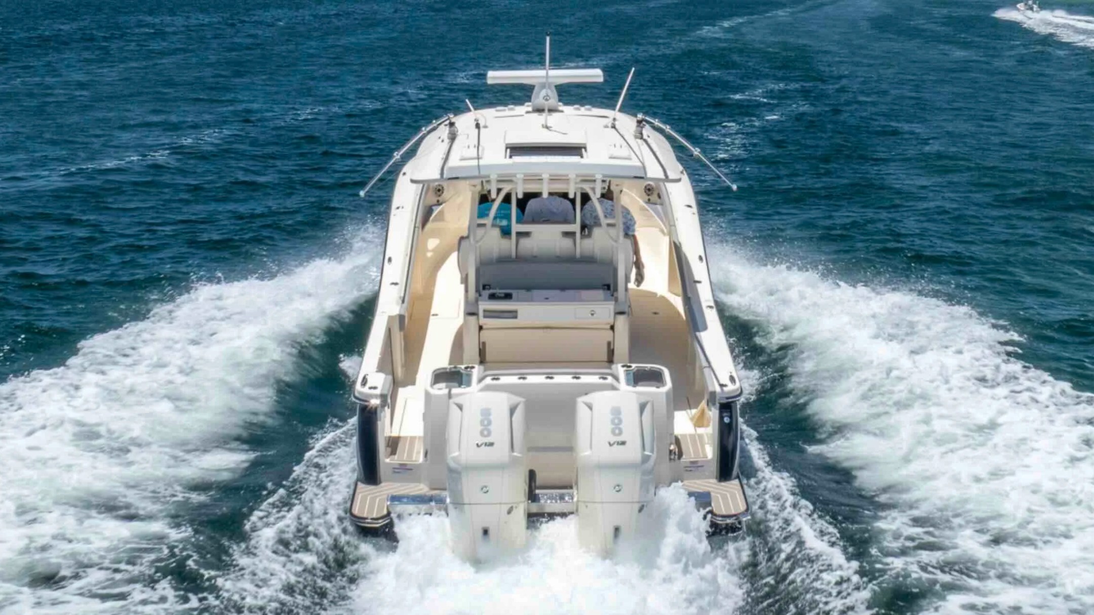 Rear view of a 43' Scout Boat Rental cruising through Palm Beach waters.