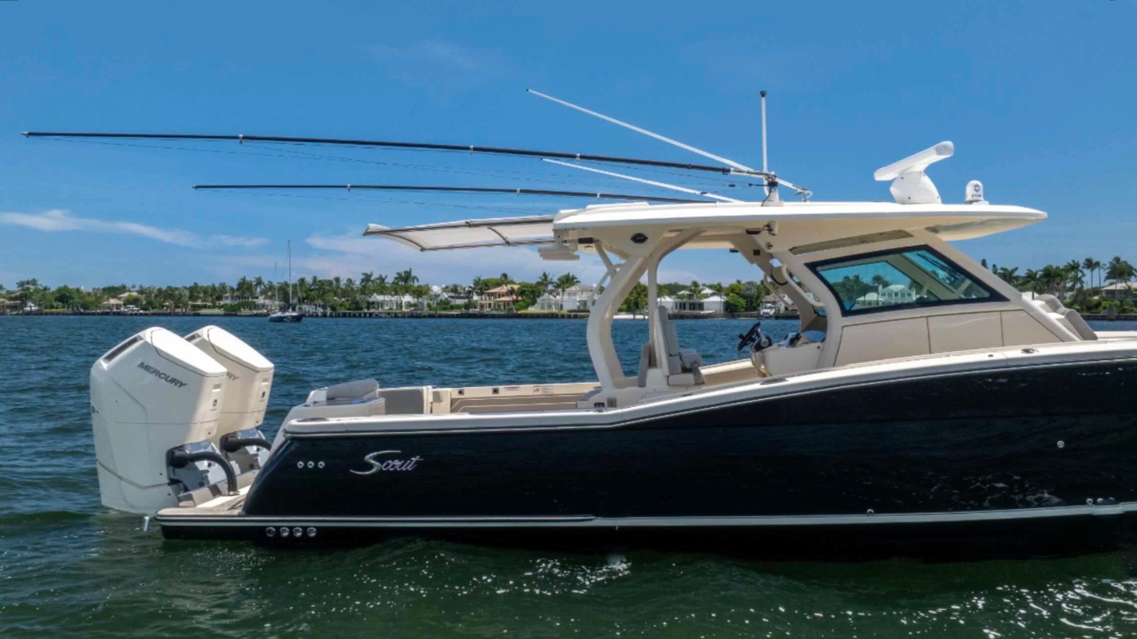 Starboard profile of a 43' Scout Boat Rental in Palm Beach with twin Mercury outboards.