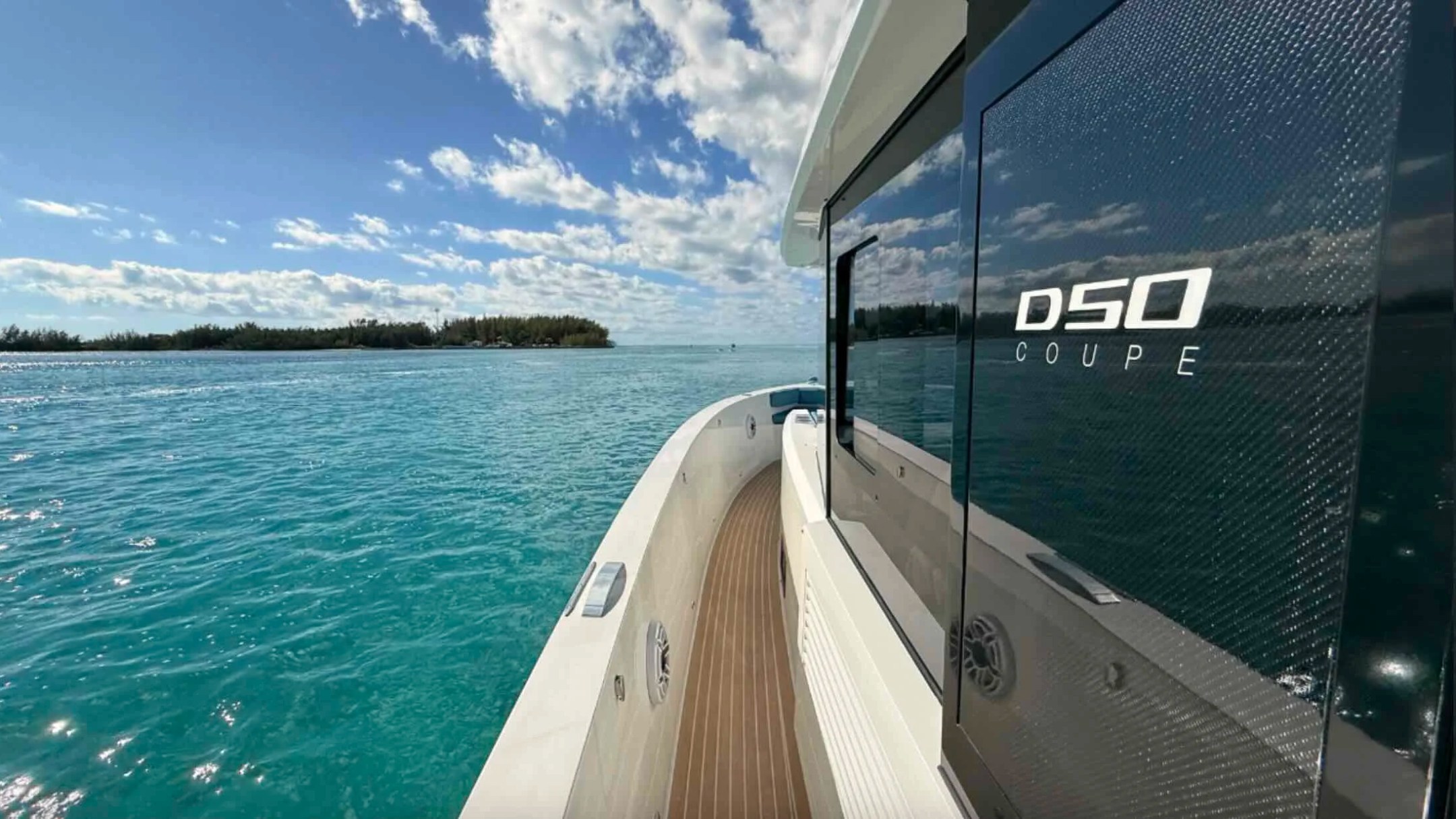 Side deck walkway aboard a 50' DeAntonio Yacht Charter in Palm Beach overlooking crystal-clear Atlantic Ocean waters with sleek modern styling and panoramic coastal views.